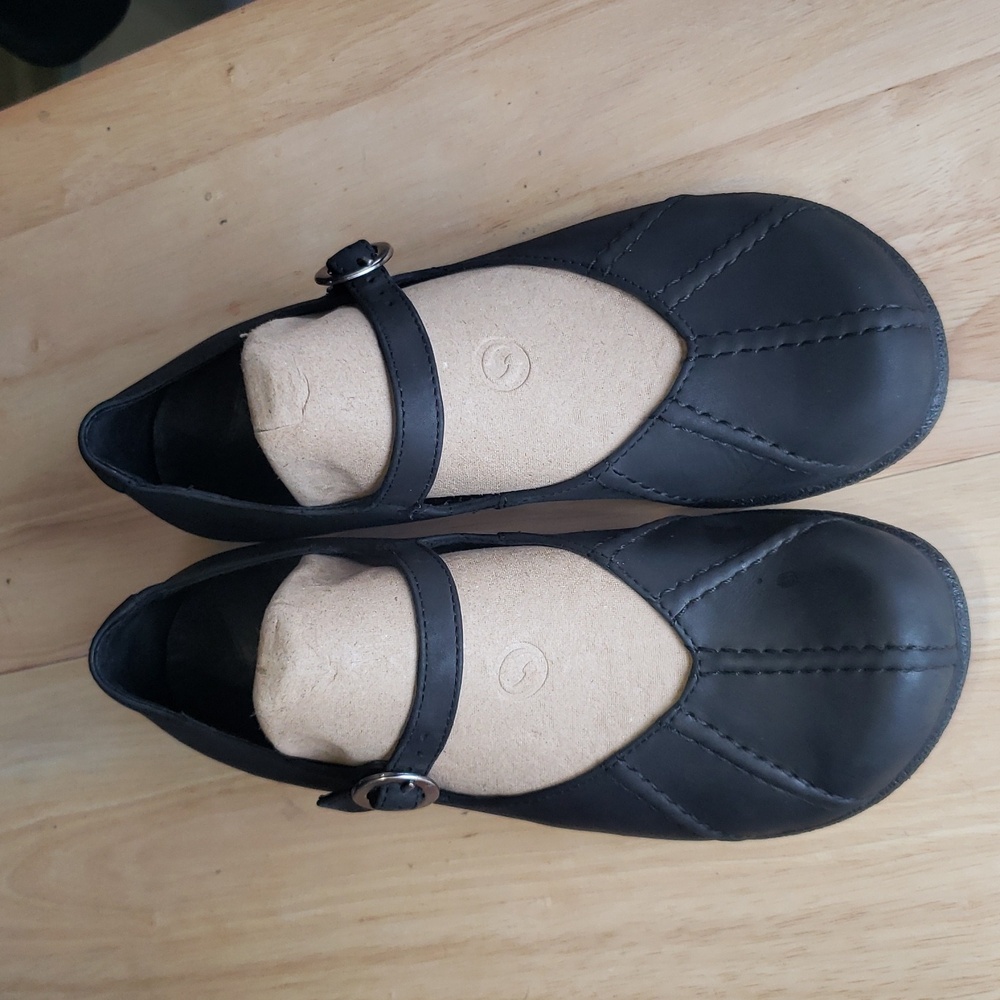 Dansko Black Flats with Elegant Rounded Toe and Smooth Finish